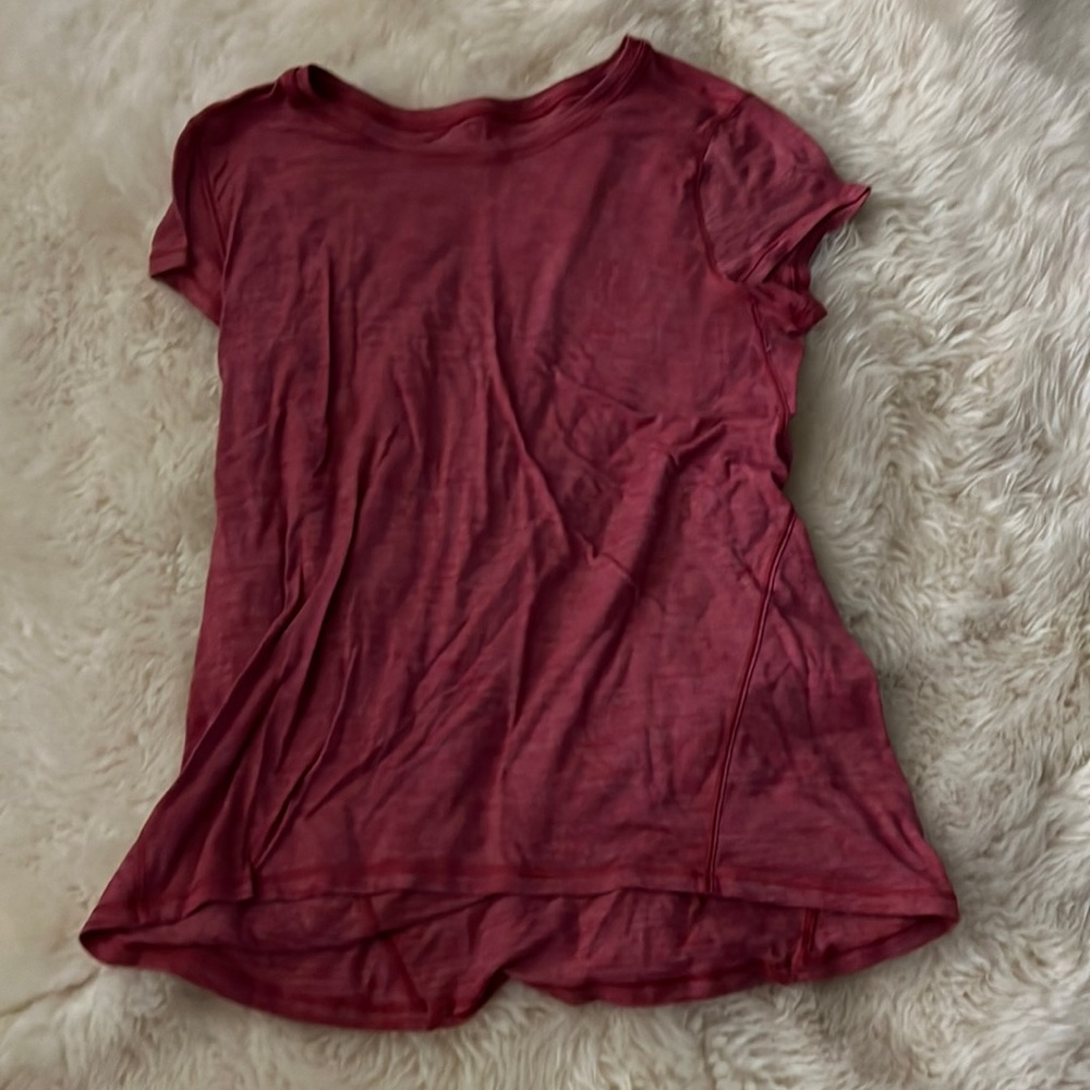 This is Lululemon short sleeve shirt, size 8.